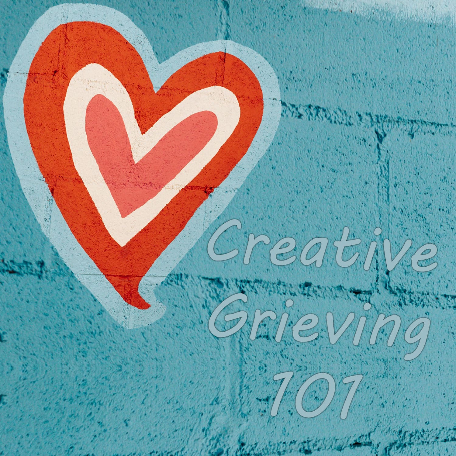 Blulish brick wall with red pink white heart and the words Creative Grieving 101 on it